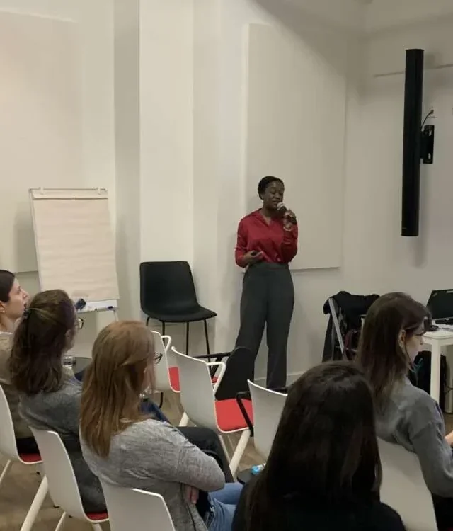 Samantha giving a nutrition talk to a seated group
