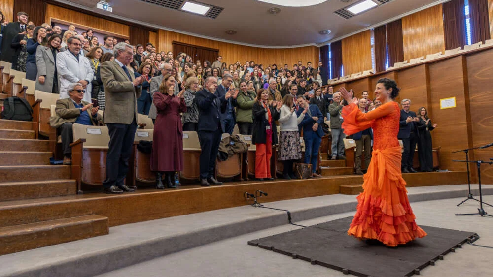 A flamenco dancer performing on a conference stage