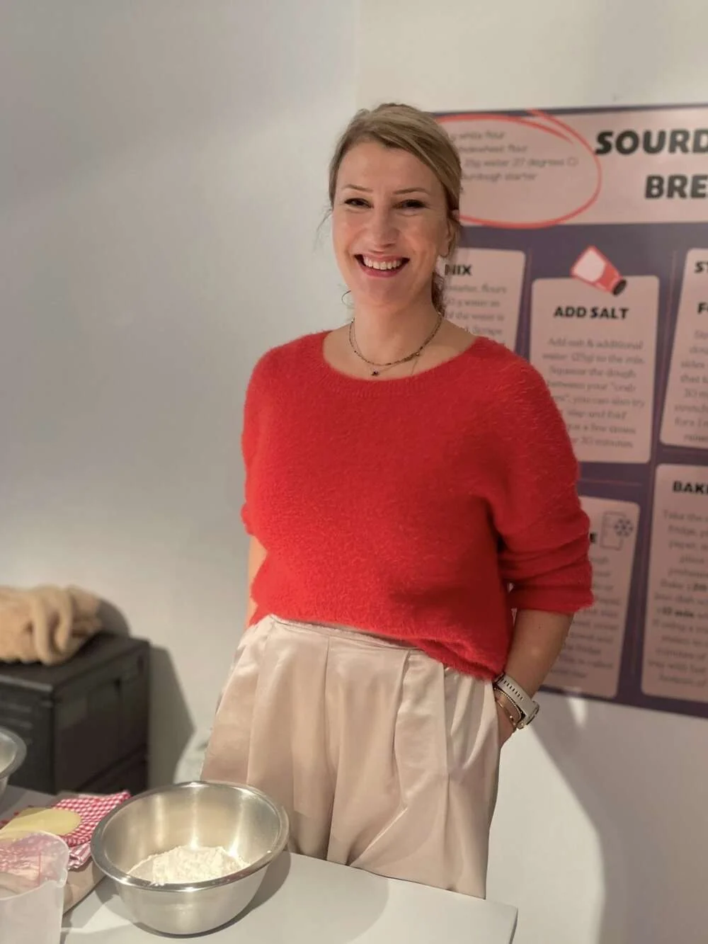 Portrait of a workshop designer beside her baking table